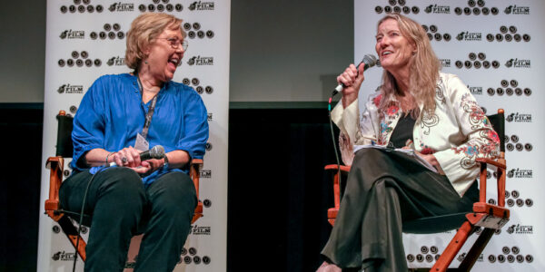 Olive Talley speaking with an Austin Film Fstival offiicial